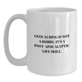 Funny Geocaching Gifts from Friends for Birthday, White Coffee Mug with 'Geocaching Is Not A Hobby. It's A Post-apocalyptic Life Skill.' Quote, 11oz or 15oz Ceramic Mug - Main